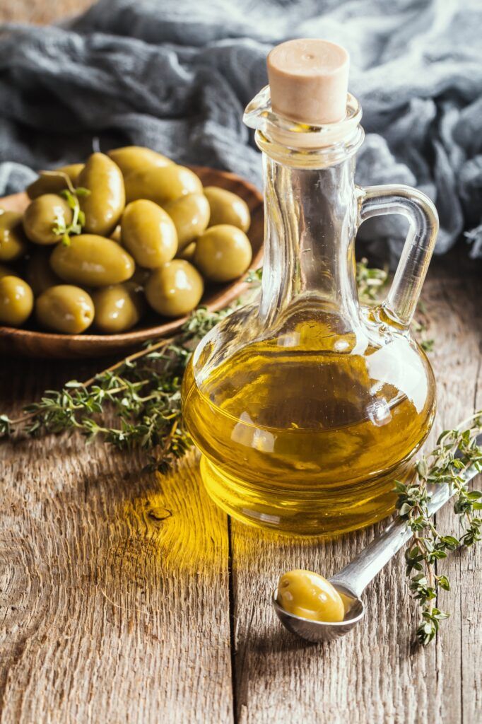 Olive oil and bowl of olives